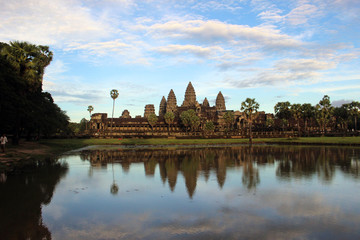 Fototapeta na wymiar The view around Angkor Wat and its reflection. An essential destination in South East Asia