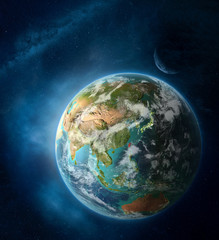 Taiwan from space on Earth surrounded by space with Moon and Milky Way. Detailed planet surface with city lights and clouds.