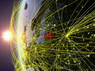 Latvia from space on model of Earth during sunset with international network. Concept of digital communication or travel.