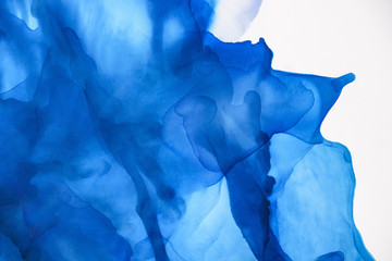 beautiful blue splashes of alcohol ink as abstract background