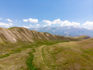 Kaldamo Pass Ak-kya &ndash; Kazarman Downhill or Level Roads. Mountains in Kyrgyzstan Near Kazarman. Gravel Curves in Kyrgyzstan