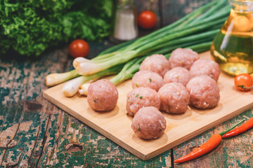 Homemade food. Raw fish ball (uncooked) in the kitchen with vegetables