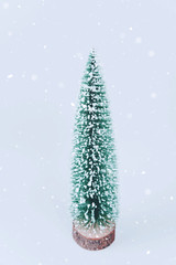 Christmas tree over light blue background.