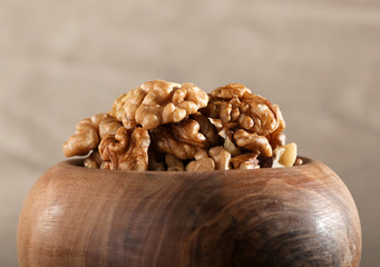 Close up of walnuts in a wooden bowl