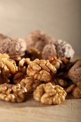 Fototapeta na wymiar Close up of walnuts on the wooden board