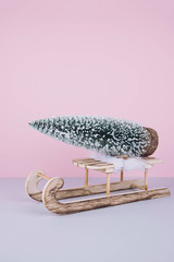 Stylish vintage wooden sled with xmas tree.