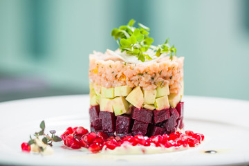 Vegan dish with beet, zucchini and pomegranate