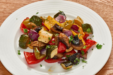 Sliced vegetables baked in the oven nice serving on a plate
