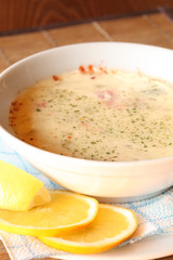 Cream soup in white bowl on the table