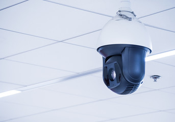 Cctv camera mounted on the ceiling in the office building or  various public places, With space for place your text.