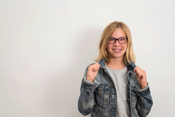 Health, education and people concept. Happy teen girl in braces and eyeglasses isolated.