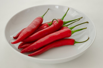 Red chili peppers isolated on white background.