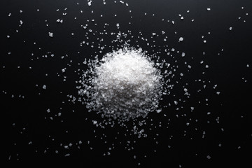 Crystal Of Large Sea Salt On A Black Background. Close Up. Top View.
