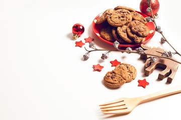 ball gloss with cookies biscuit and reindeer wood toy and season greeting merry christmas prop decoration on white background