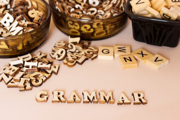 wooden letters forming grammar text