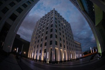 modern office buildings night with sunset light fisheye