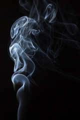 White smoke against black background