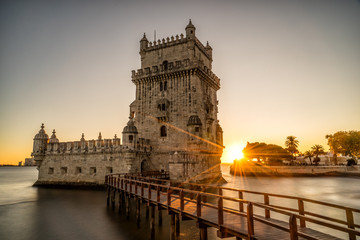 The  Belem Tower (Belém Tower) at sunset.  A medieval castle fortification on the Tagus river of Lisbon Portugal