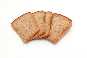 Slices of dark rye bread on white background