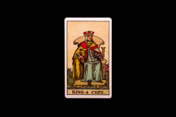 An individual minor arcana tarot card isolated on black background. King of cups.