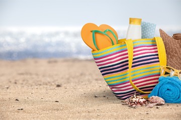 Colorful Bag on Summer Beach, travel concept