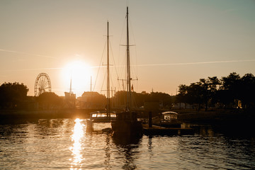 Fototapeta na wymiar La Rochelle, France: 26 August 2018: Embankment at the La Rochelle city early in the morning at sunrise