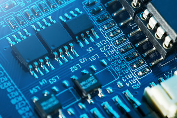 Electronic circuit board close up. Processor, chips and capacitors.
