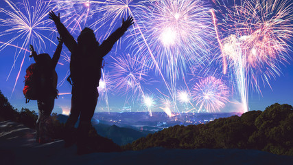 Lover women and men asians. Stand and raise hands watch the fireworks. Happy on the day of the...
