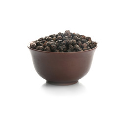 Bowl with black pepper grains on white background