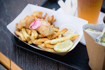 Fish and ships with a pint of beer served at the street cafe