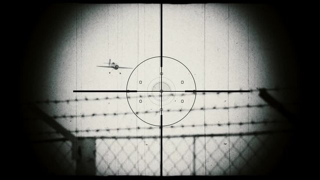 Hunting a military airplane. World War II era airplane. View through binoculars