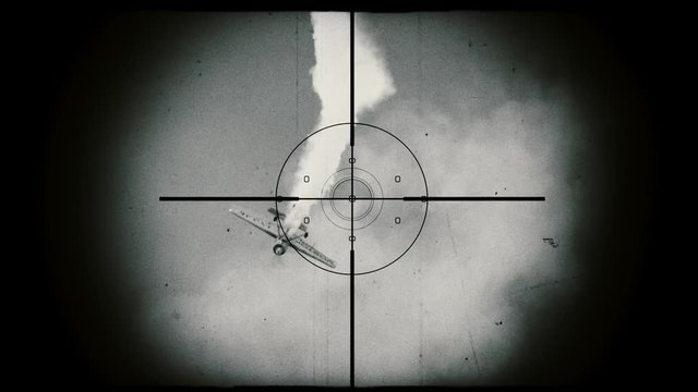 Hunting an airplane which falls down. View through binoculars