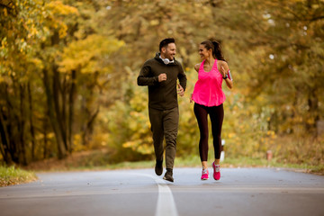 Fototapeta premium Young people jogging and exercising in nature