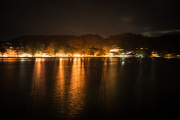 reflections on a lake at night