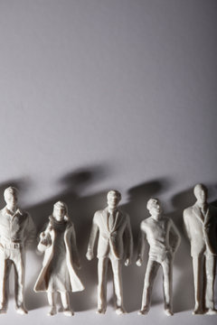 line-up of models of people with shadows