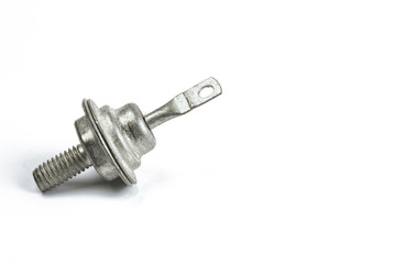 Radio element, a very old diode close-up, on a white background.