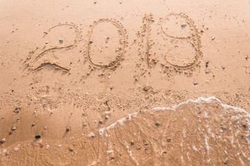 New Year 2019 is a concept - the inscription 2019 on a sandy beach