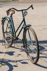Fototapeta na wymiar Retro bicycle parked on city street
