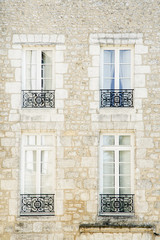 Fototapeta na wymiar Symmetrical facade of french building at the old town