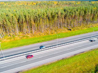 Aerial view of highway. Cars crossing interchange overpass. Highway interchange with traffic....