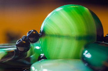 Large polished beads of beautiful translucent green agate gemstone, macro