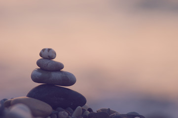 stack of zen stones on pebble beach