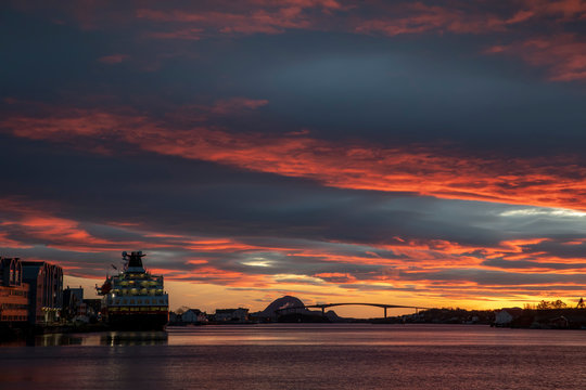 Passenger ship at quay in Brønnøysund with colorful clouds, Nordland county