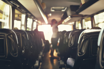 laying hand luggage in the bus