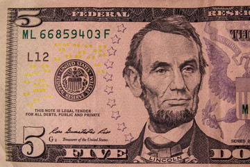 Closeup of american five dollars banknote
