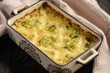 Zucchini and potatoe casserole with cheese,  vegetarian food.