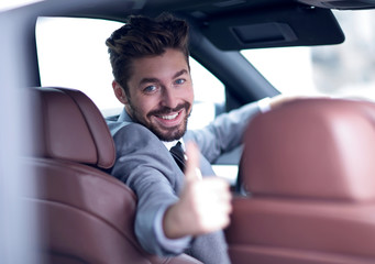 Portrait of a man driving his car