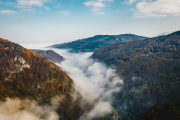 Jiului Valley panorama in the Carpathians on a foggy morning