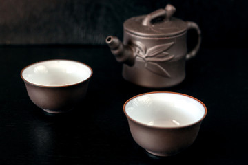 Chinese brown teapot and cups for tea