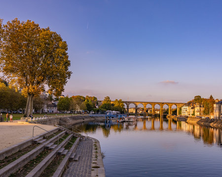 Scenes from Laval France along the Mayenne river with castles and churches